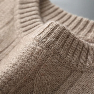 Cable-knit crewneck sweater with ribbed cuffs and hem for a structured finish.