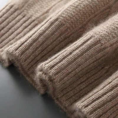 Cable-knit crewneck sweater with ribbed cuffs and hem for a structured finish.