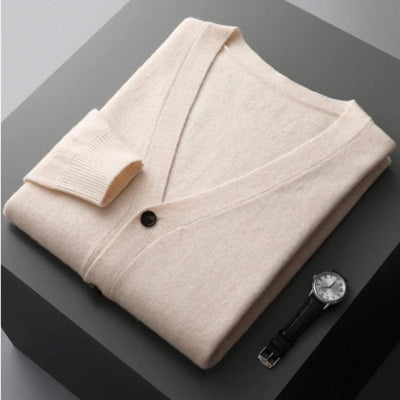 V-neck merino wool cardigan with front button closure and ribbed cuffs.