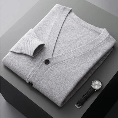 V-neck merino wool cardigan with front button closure and ribbed cuffs.
