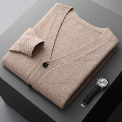 V-neck merino wool cardigan with front button closure and ribbed cuffs.