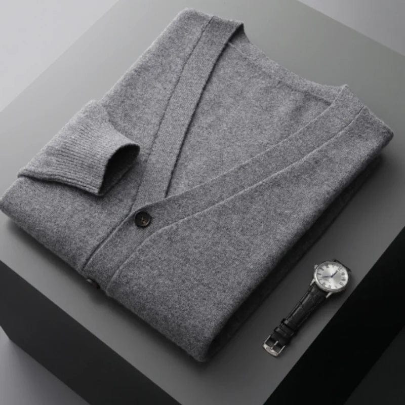 V-neck merino wool cardigan with front button closure and ribbed cuffs.