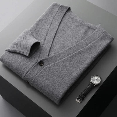 V-neck merino wool cardigan with front button closure and ribbed cuffs.