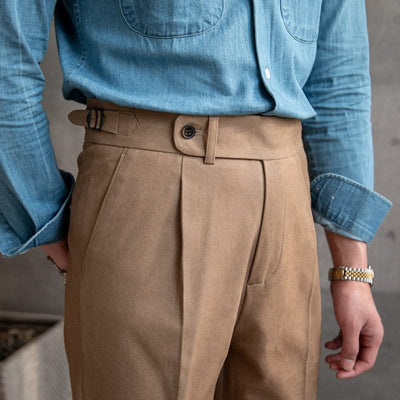 Tailored pleated dress trousers with high waist and cuffed hem