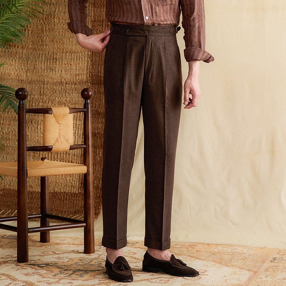 Pleated cuffed trousers with high-rise waistband and tailored structure