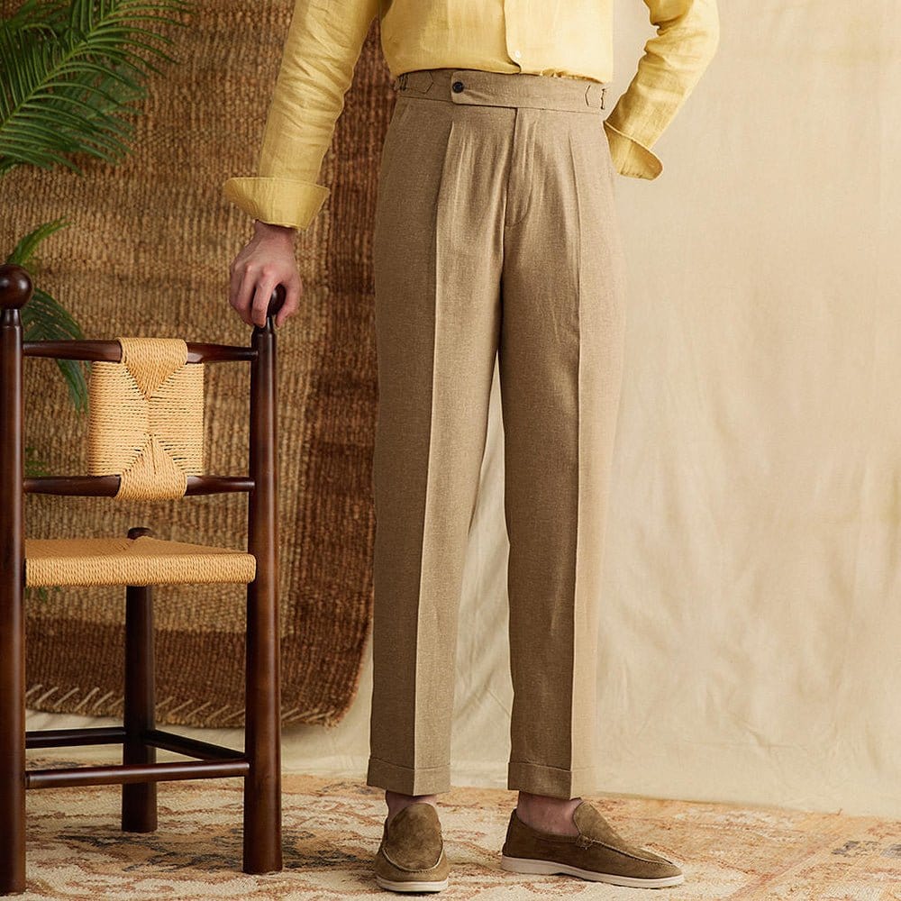 Pleated cuffed trousers with high-rise waistband and tailored structure