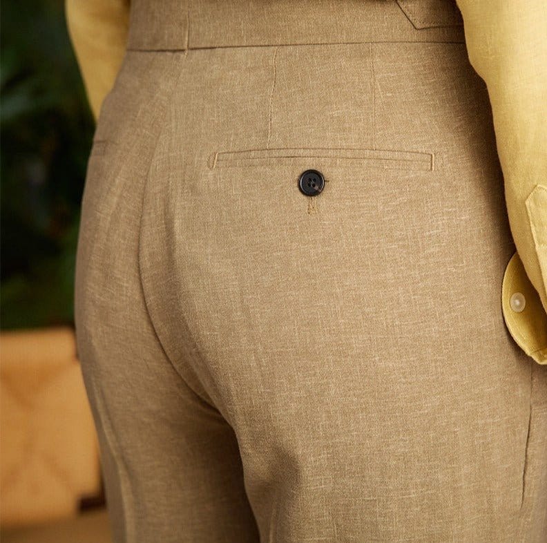 Pleated cuffed trousers with high-rise waistband and tailored structure