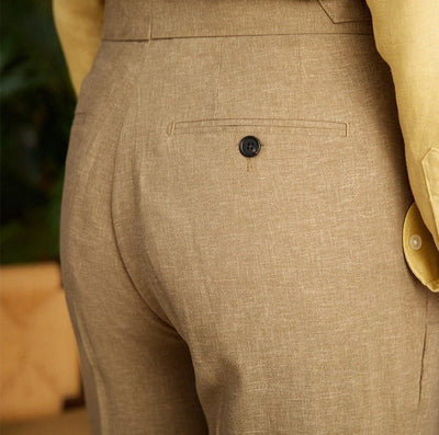 Pleated cuffed trousers with high-rise waistband and tailored structure