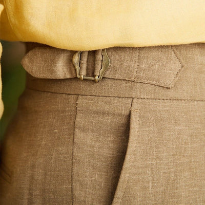 Pleated cuffed trousers with high-rise waistband and tailored structure