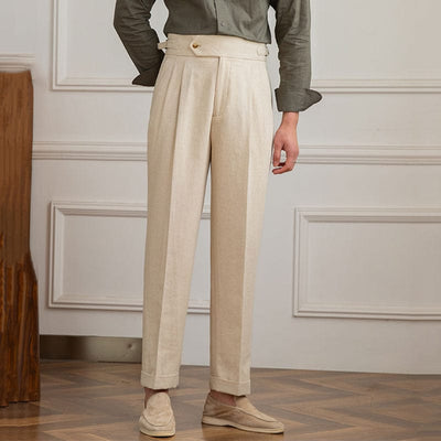 High-waist pleated trousers with tailored cut and button-tab waistband