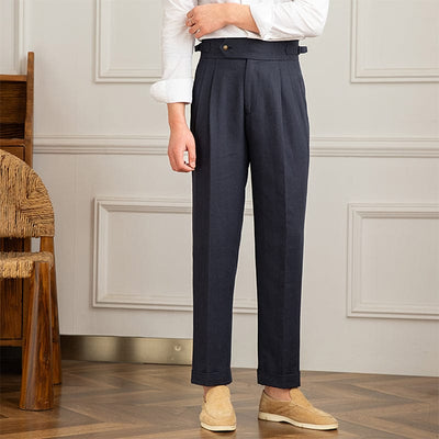 High-waist pleated trousers with tailored cut and button-tab waistband