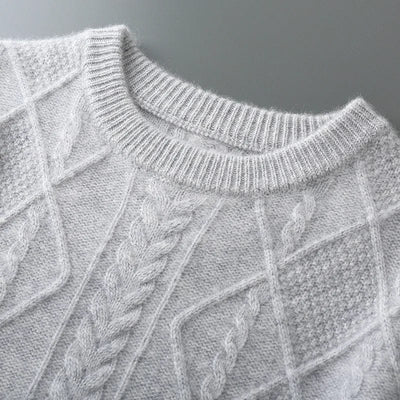 Crewneck cashmere sweater with textured diamond pattern and ribbed cuffs.