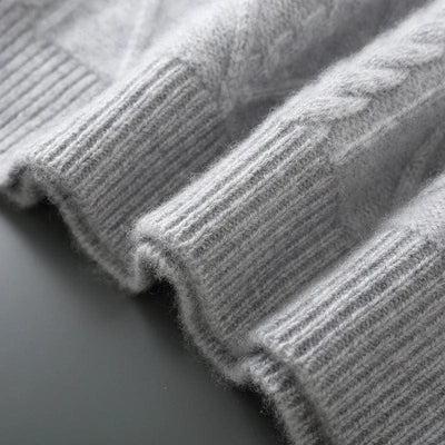 Crewneck cashmere sweater with textured diamond pattern and ribbed cuffs.