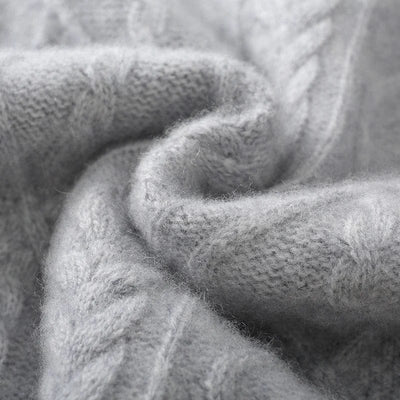Crewneck cashmere sweater with textured diamond pattern and ribbed cuffs.