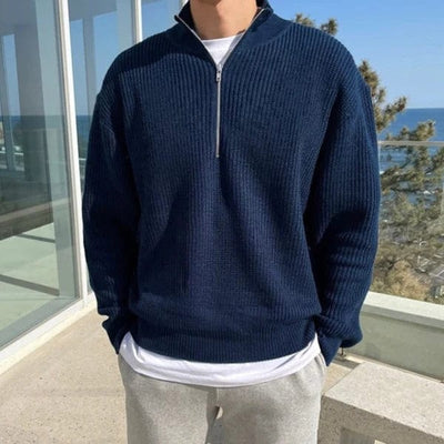 Ribbed knit zip-up pullover with high collar and front half-zip design